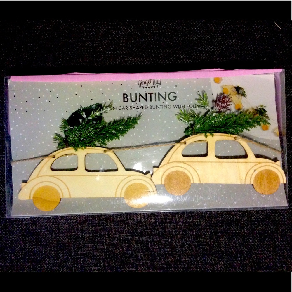 Bunting of Cars hauling rooftop Christmas trees